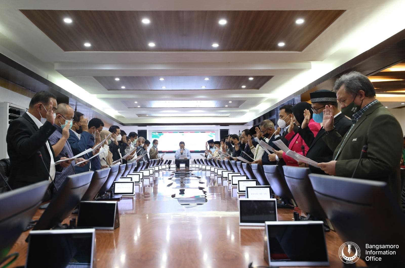 Members of the BARMM cabinet seated along a long table lined with laptops.